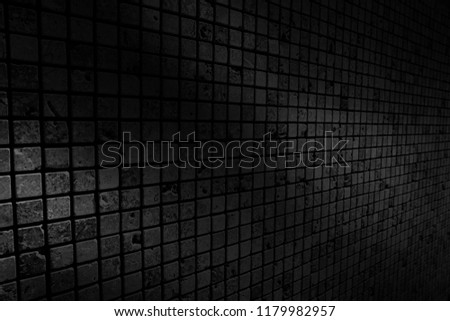The black wall surface uses a lot of bricks. Or old black brick wall abstract background