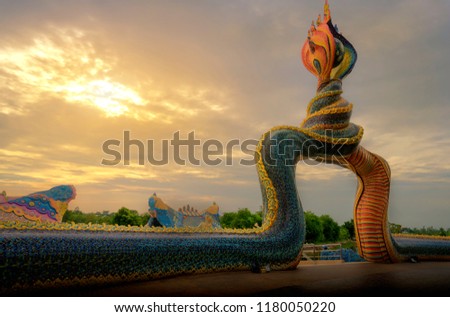 This is temple in Nakhorn Rajasima province Thailand call Wat Ban Rai. This temple building over river the building look likes flying elephant and decoration by Naga. this picture show Naga tail gate.