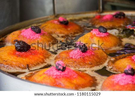 Torrejas, are a traditional food in Guatemala. They are made with sweet bread stuffed with custard, fried and drowned on a light sauce of water, sugar and other ingredients. Royalty-Free Stock Photo #1180115029