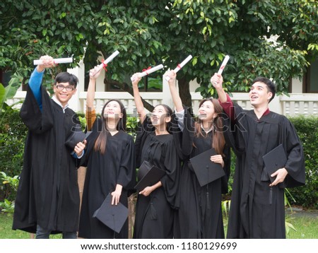 Graduation Friend Achievement Celebrate Degree Concept.Beautiful Asian university graduates celebrate their success.