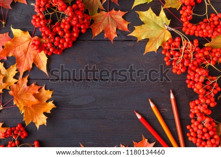 autumn leaf on wood black background orange leaf on old grunge wood deck, copy place for inscription, top view, tablet for text