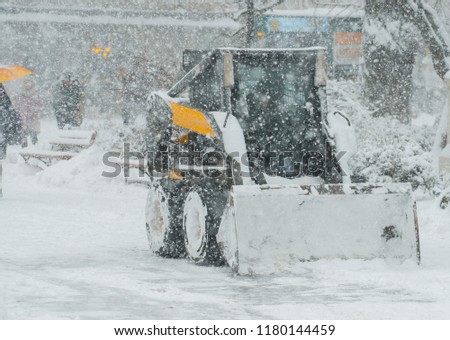 snow machine removes snow. The concept of bad weather. A storm warning