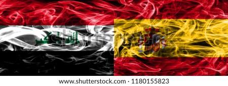 Iraq vs Spain colorful concept smoke flags placed side by side