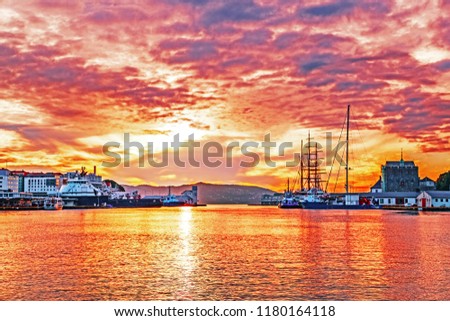 Port in city Bergen - the first capital of Norway. Epic sunset over Northern sea. Bergen is famous travel destination, the port accept international cruise ships. Landscape photography.