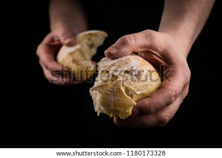 Helping hand giving a piece of bread. Man giving Bread, Helping Hand Concept.