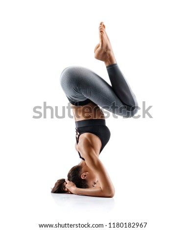 Young girl practice balance asanas isolated on white background. Concept of healthy life and natural balance between body and mental development. Full length