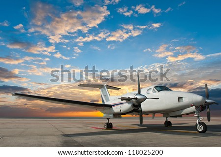Propeller plane parking at the airport Royalty-Free Stock Photo #118025200