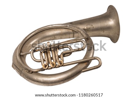 Old vintage French horn on a withe background, isolated