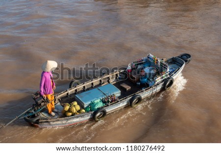 Unidentified people buy and sell Vietnamese food on boat, ship in Cai Rang floating market at Mekong River. Royalty free stock image of the floating market or river market in Can Tho city, Vietnam