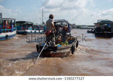 Unidentified people buy and sell Vietnamese food on boat, ship in Cai Rang floating market at Mekong River. Royalty free stock image of the floating market or river market in Can Tho city, Vietnam