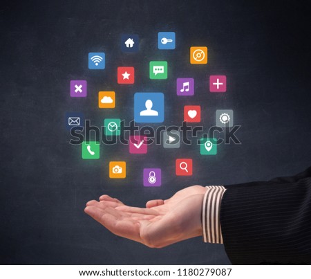 Colorful applications hovering over young hand
