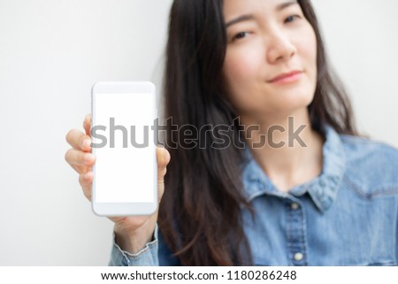mockup image beautiful young women happy cheerful face smilling.hand holding mobilephone with blank space for text on white background.concept for marketing trade advertisement 
