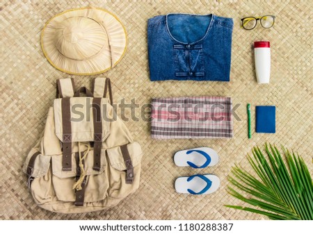 Overhead view of Travel and live in the countryside of Thailand items with uniform of native Thailand in countryside and Palm leaf hat and thai loincloth and Mauhom Shirt.Travel Thailand concept