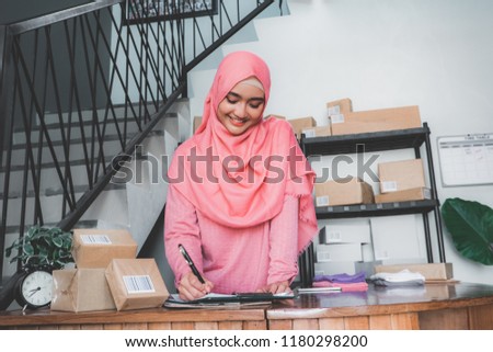 woman working in package delivery service office