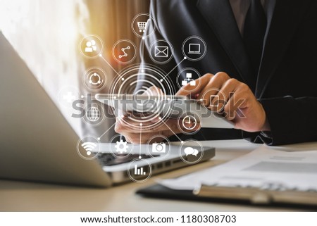 Coding software developer work with augmented reality dashboard computer icons  with responsive cybersecurity.Businessman hand working.
