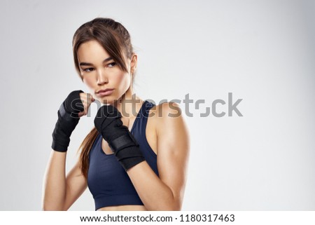 woman wrestling in gloves blue mark                          