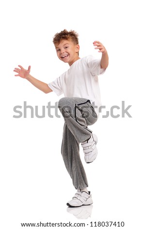 Happy little boy dancing isolated on white background