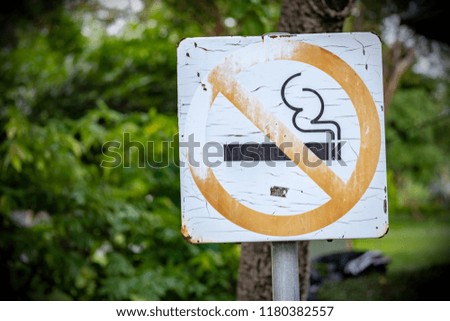 Non smoking sign in the park because of illegal