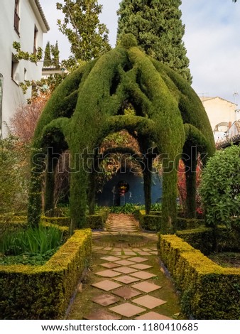 Detail of a garden in Granada, Spain. Beautiful green arch