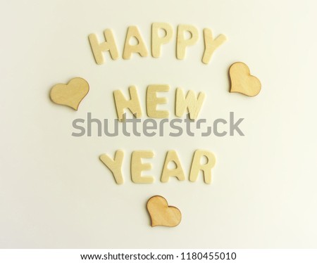 New Year decorative composition with letters and small hearts. Happy New Year festive card.