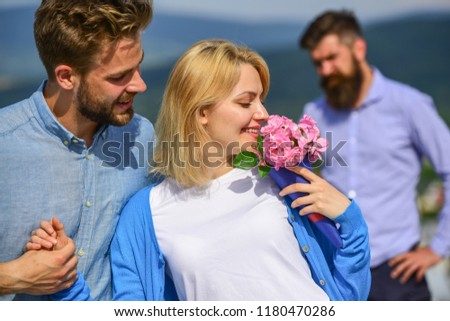 Couple in love happy dating, jealous bearded man watching wife cheating him with lover. Couple romantic date lovers flirting. Lovers meeting outdoor flirt romance relations. Broken heart concept. Royalty-Free Stock Photo #1180470286