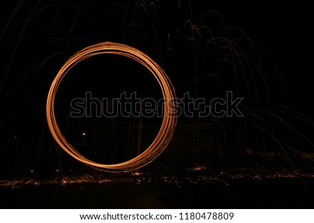 abstract under expose light trail of steel wool photography Royalty-Free Stock Photo #1180478809