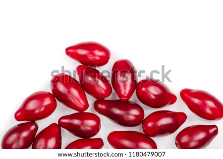 Red berries of cornel or dogwood isolated on white background with copy space for your text. Top view. Flat lay