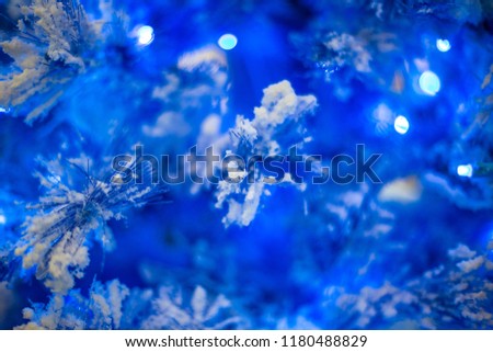 Abstract unfocused backgrounds with Christmas decorations with led light bokeh - close-up photo.