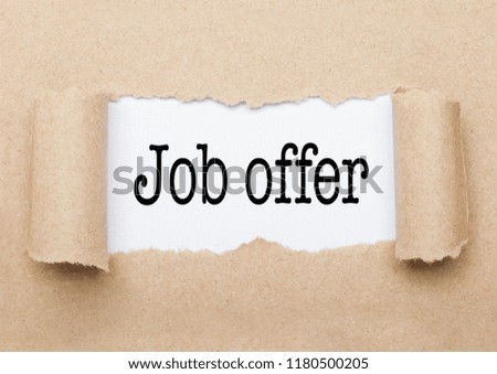 Job Offer concept text appearing behind torn brown paper envelope
