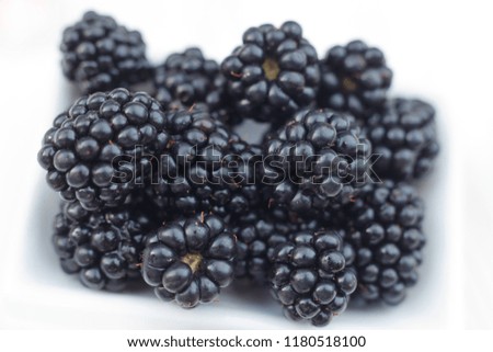 Background from fresh Blackberries, close up. Lot of ripe juicy wild fruit raw berries lying on the table. Top view, Flat lay