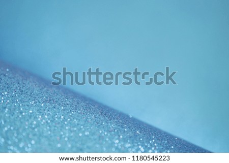Blue glitter background. Holiday theme. 