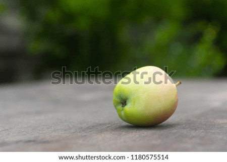 Ripe juicy apple on wooden table