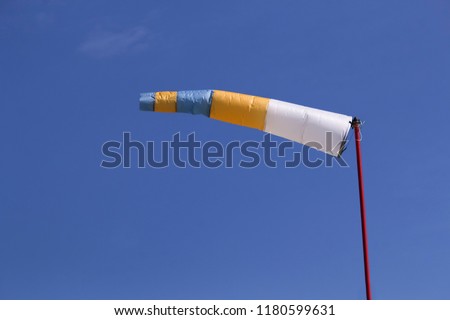Windsock as a gauge for winds, wind vane on the aerodrome airfield on an air show
