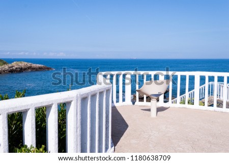 Summer white beach chair with blue sky background