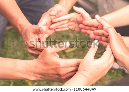 Close-up of people put hands together in circle. Unity concept Royalty-Free Stock Photo #1180644049