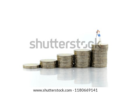 Miniature people : Golfer teams playing stand with stack of coins , sport and business concept.