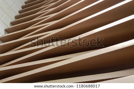 Blurred photo of Beige color Medium-density fiberboard or call another name is mdf and stacked several layers and overlapping for Dimensional view and beauty and unique.