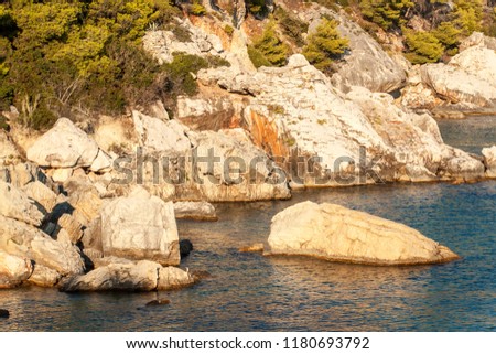Croatian seashore. Coast of Hvar Island. Greetings from the sea. Sea and rocks in Croatia. Landscape of the Adriatic Sea. Hot summer day