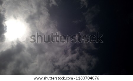 sun smile with clouds Royalty-Free Stock Photo #1180704076