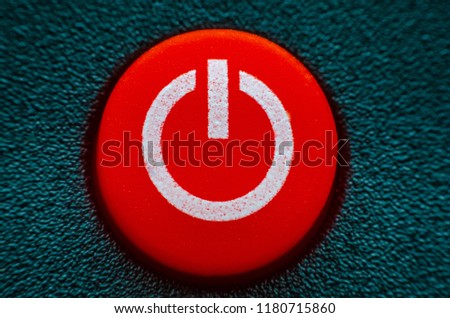 Close up White Turn On/Off Button Isolated On Red Background