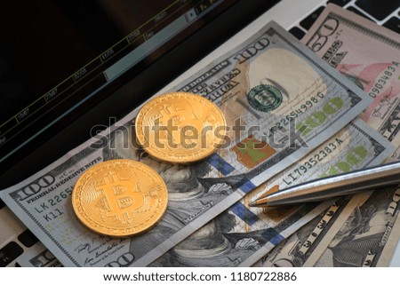 Close-up pen on USD banknote and coin vintage tone, Business concept a pen with money