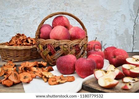 Red and dried apples in a baskets. 