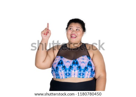Picture of obese woman wearing sportswear while thinking an idea, isolated on white background