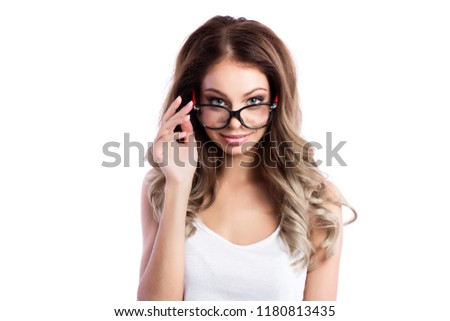 Photo of a young curled-haired woman with glasses pictured in the white background.