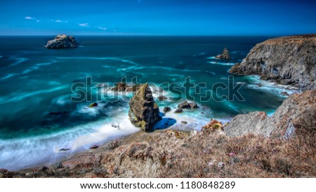 Landscape view of Bodega Bay in Sonoma County in California, USA, on a typical summer day in the morning, featuring blue water and blue sky Royalty-Free Stock Photo #1180848289