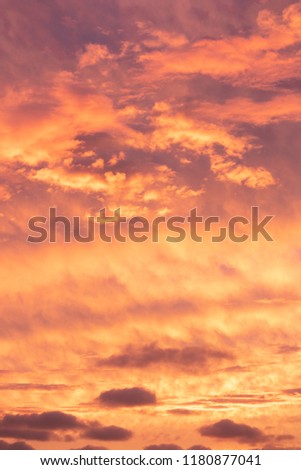 Colourful picture of a clouded sunset. Orange to slightly purple