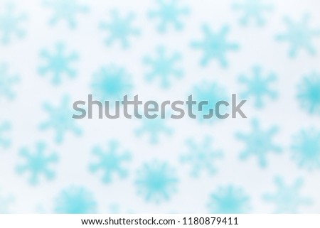 Blue snowflakes in defocus blur for backgrounds on a white background New Year and Christmas concept for design of greeting cards and letters Santa Claus with copy space