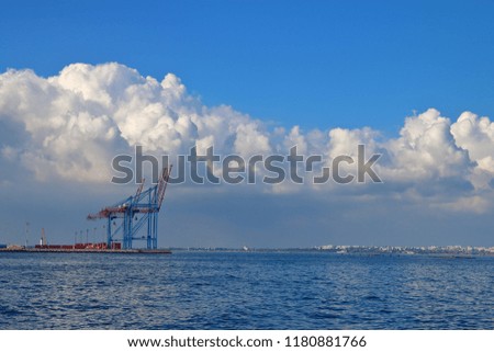 The picture was taken in Ukraine, near the city of Odessa. In the photo, an unusual sky above the harbor of the seaport after a rainy cyclone.