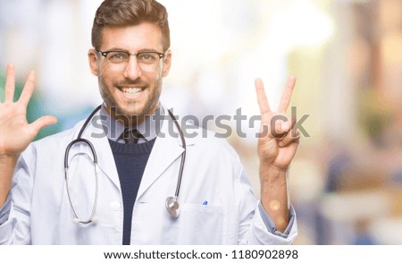 Young handsome doctor man over isolated background showing and pointing up with fingers number seven while smiling confident and happy.