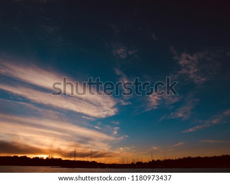 Dramatic sky and beautiful sunset over the Baltic Sea in Espoo, Finland, Europe, Natural background